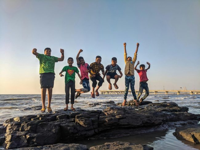 kids jumping in water