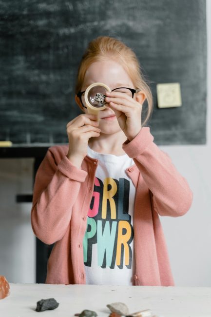 girl with magnifying glass